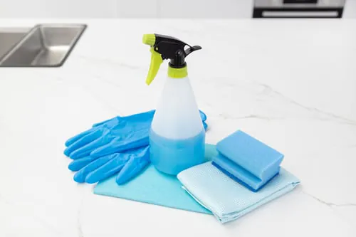 J&K Top Cleaners team member cleaning a kitchen counter